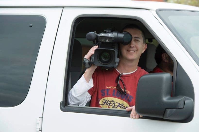 Mike Martin in a white van with a video camera